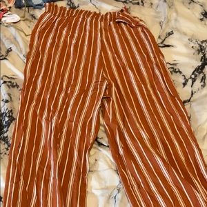 orange and white striped flowy pants.